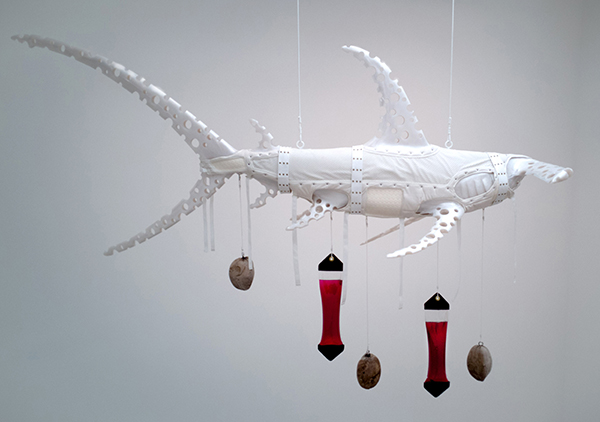 Ashley Bickerton - \"Albino Shark\", 2008 <p>  
Pearlescent polyurethane resin, nylon, cotton webbing, stainless steel, scope, distilled water, coconuts and rope,.
